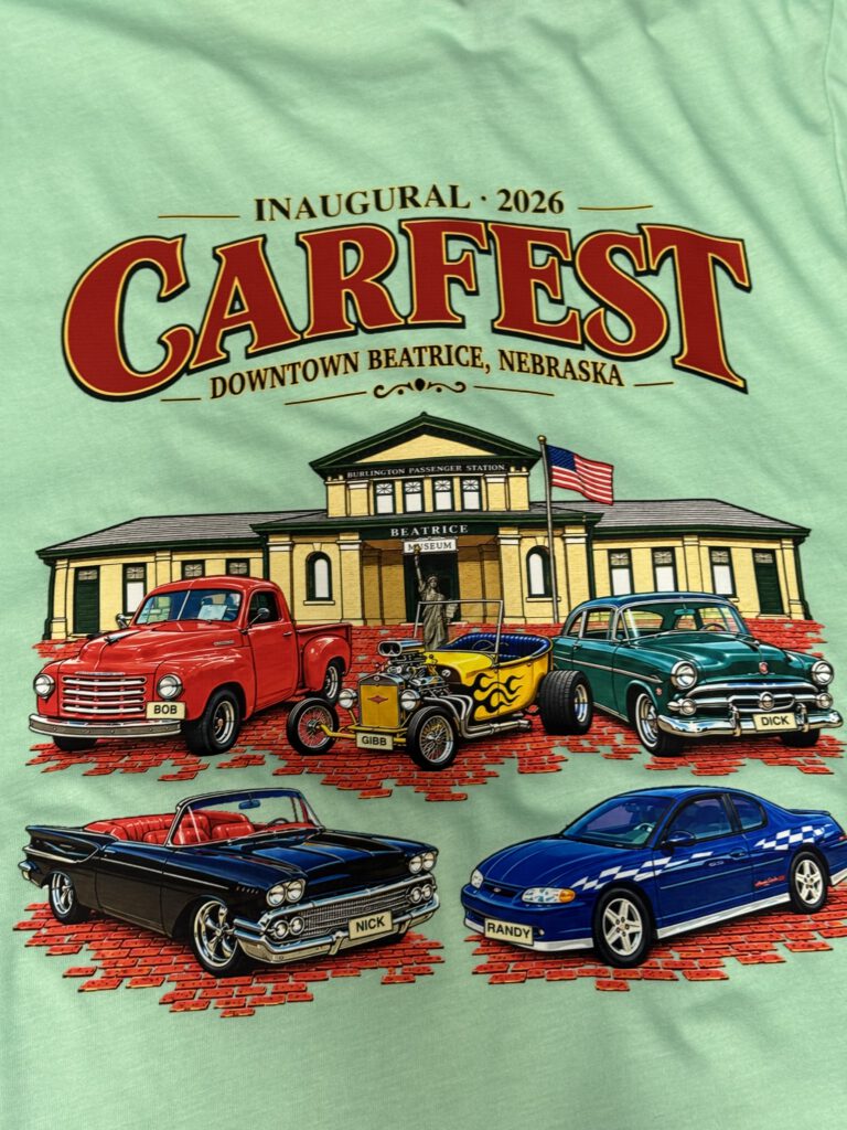 Mint green shirt printed with the full Carfest 2026 design: Inaugural Carfest, Downtown Beatrice, Nebraska, with classic cars in front of the Burlington Passenger Station