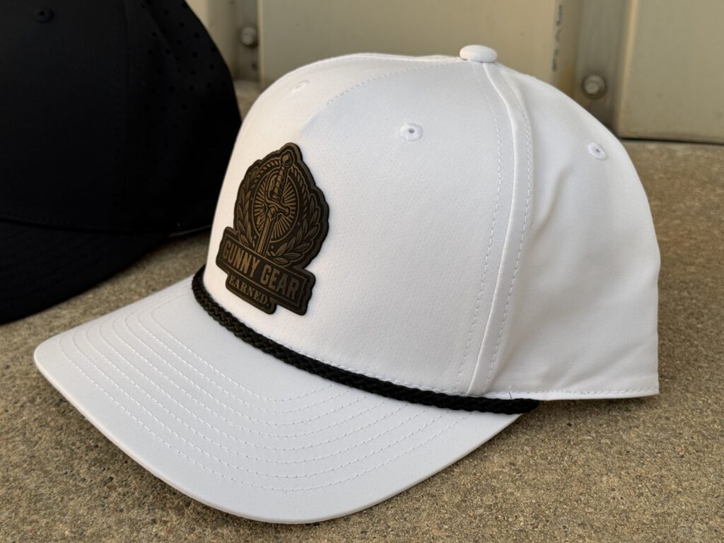 White rope hat with a bronze Gunny Gear patch: a sword in a laurel wreath above the words Gunny Gear Earned