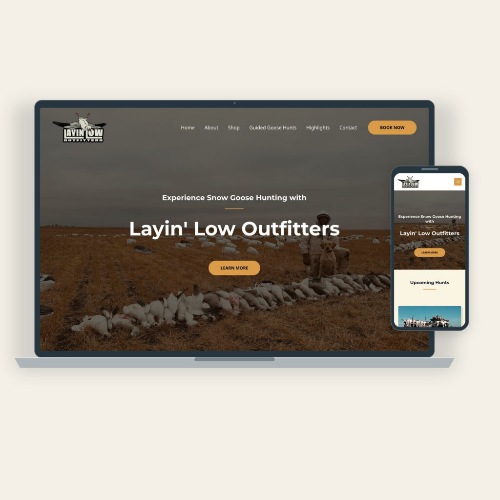 Layin' Low Outfitters website home page on a laptop and a phone